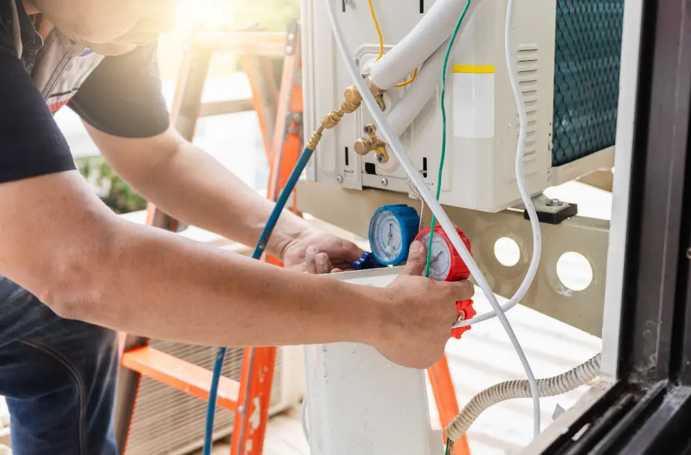 Hot and Cool HVAC technician working on a heating system in Calgary