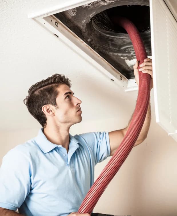 Residential Duct Cleaning, Hot and Cool HVAC technician on-site in Calgary
