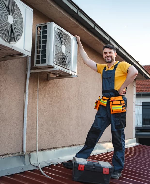 HVAC technician servicing a rooftop cooling unit in Calgary